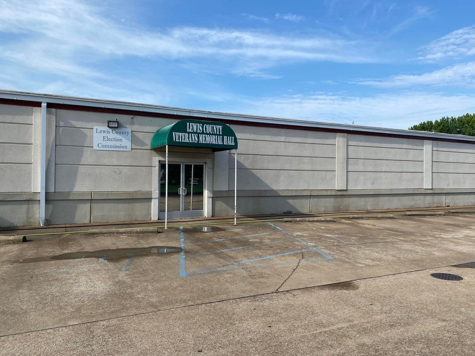 Lewis County Veterans Memorial Hall exterior with accessible entrance and signage.
